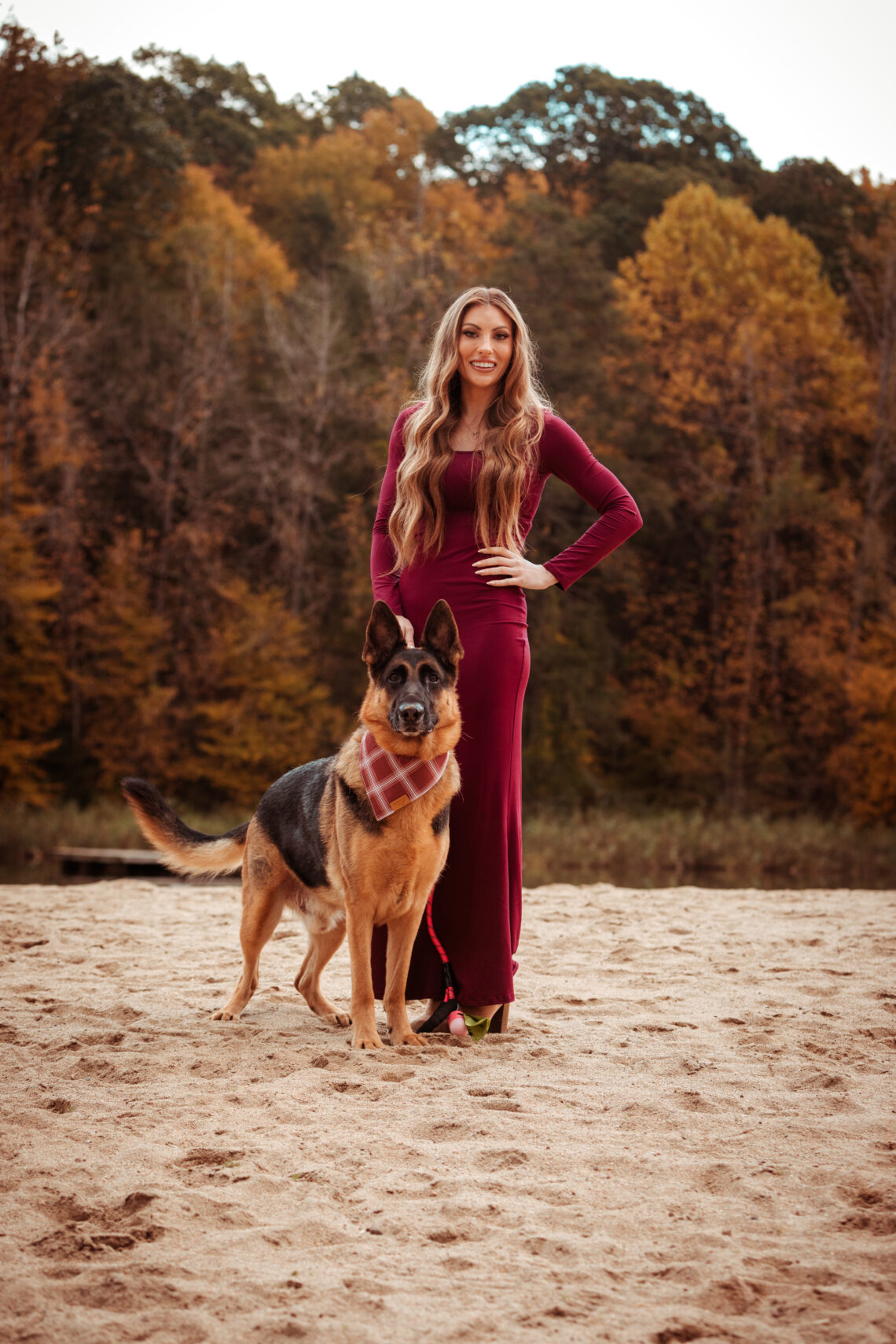 German shepherd standing with owner on a beautiful beach pet photography ct