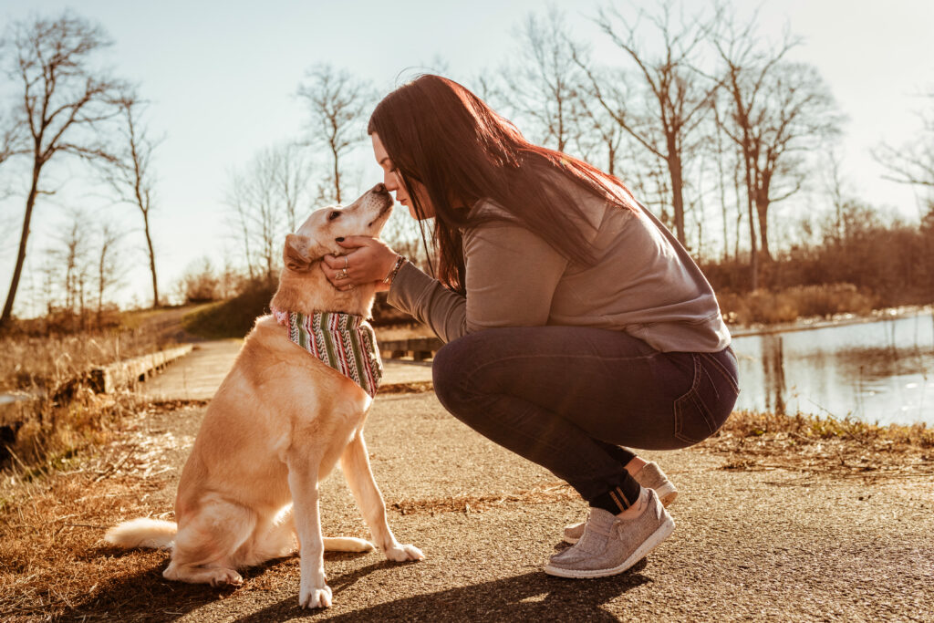 labrador mix kissing owner at sunset professional pet photography